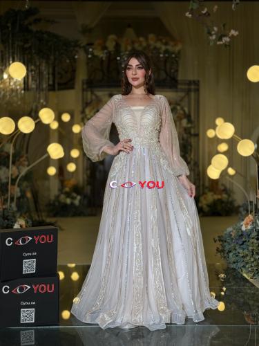 فستان سهرة شامبين فضي مطرز بتصميم فاخر وأكمام تول...