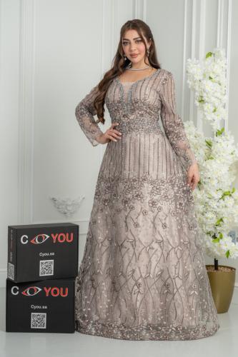 A silver evening dress with sparkling embroidery and an elegant wide cut, a sophisticated design suitable for parties and evenings...