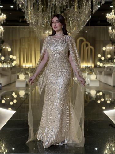 فستان لينا سهرة ذهبي فاخر مع تطريز يدوي وأكمام شفا...