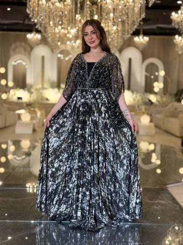 فستان سهرة فاخر تألقي بفستان سهرة ملكي أسود مزين ب...