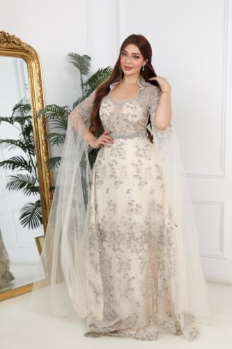 A silver evening dress with sparkling embroidery and an elegant wide cut, a sophisticated design suitable for parties and evenings...