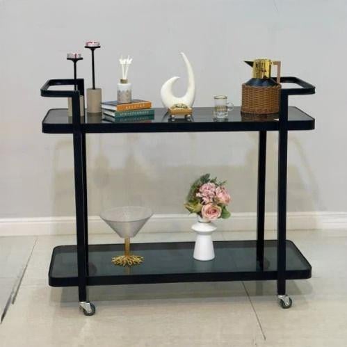 عربية تقديم دورين بلون أسود وبسطح زجاجي أسود