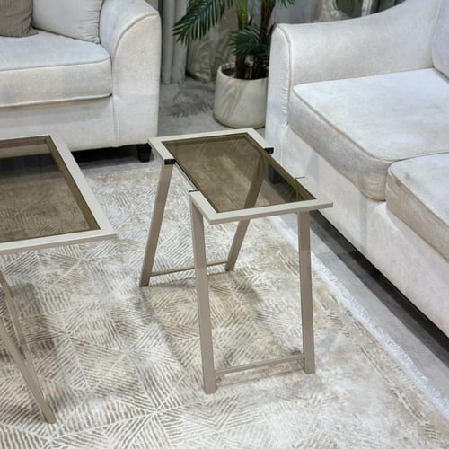 طقم طاولات شمباني أنيق بسطح زجاجي بني شفاف ولمسات...