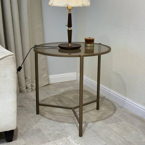طاولة جانبية دائرية قاعدة حديد نحاسي وزجاج بني شفا...