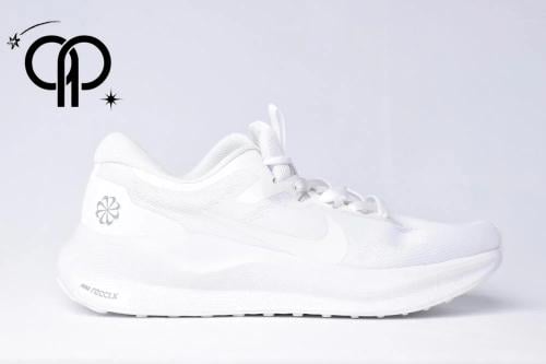 نايكي رياكت اكس فل وايت a white Nike running shoe...