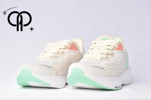 نايكي زوم اكس بيج a Nike ZoomX shoe in a beige and...