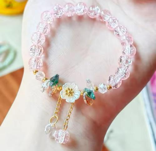 اسوارة بتعليقة ورد أبيض