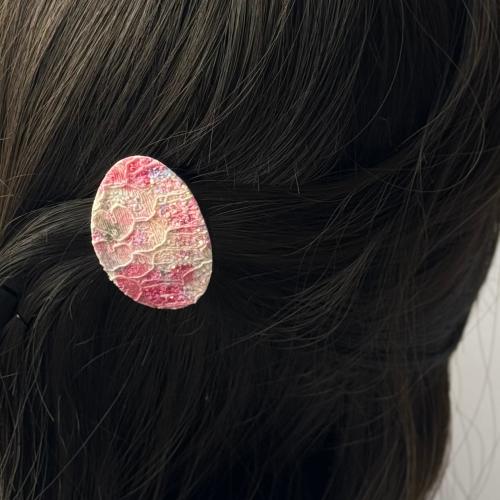 توكات جلد بيضاوي وردي مشجر مع لمعة خفيفة