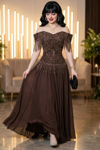 Evening dress embroidered with beads and fringe on the shoulders