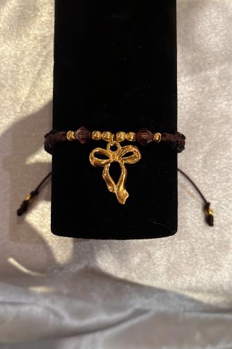 Woven bracelet with a bow