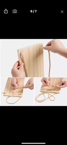 رف خشبي معلق بحبل شكل ارجوحة