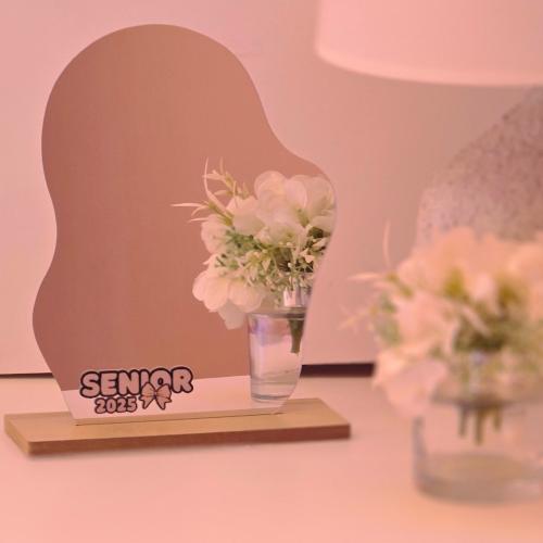 Graduation mirror with a wooden base