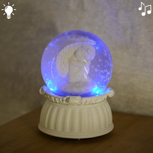 بلورة ثلجية مع موسيقة و اضاءة بتصميم ملاك لون ابيض