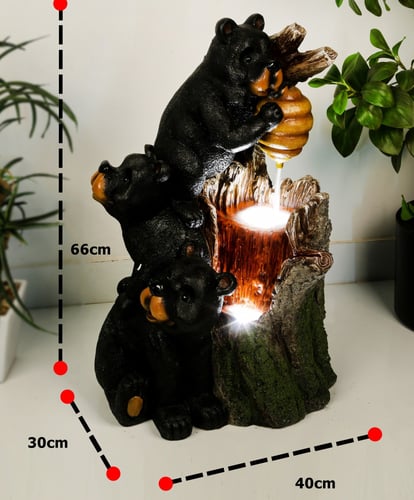 نافورة مياه مضيئة علي شكل جذع شجرة و مزين بالدب مق...