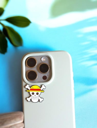 ستيكر لاصق معدني للجوال - بتصميم جمجمة لوفي