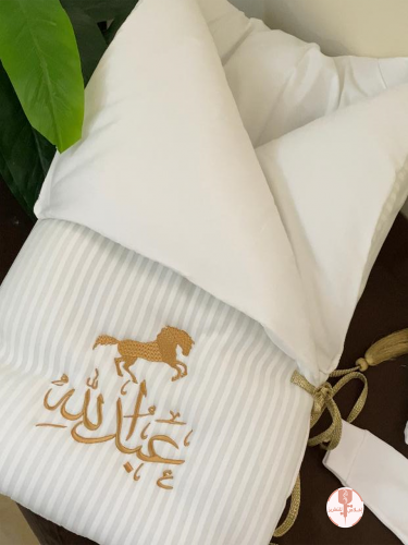 A padded birth date embroidered