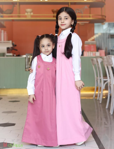 Pink primary apron with middle button closure
