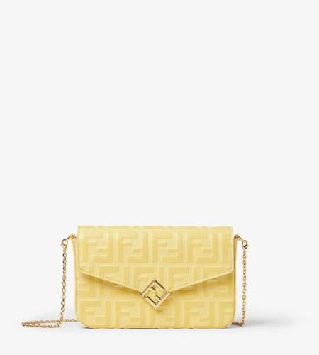 A Fendi bag in yellow with a chain and box