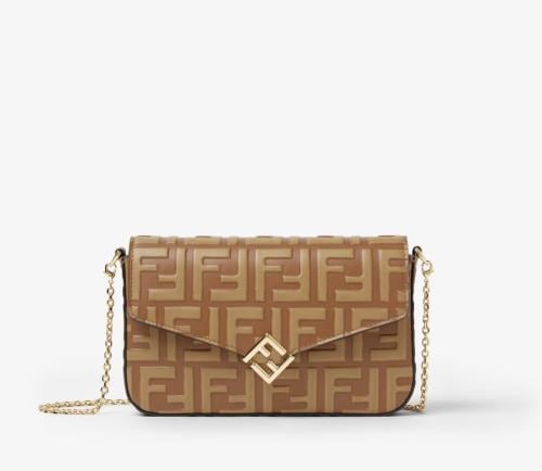 A Fendi bag in camel color with a chain and box