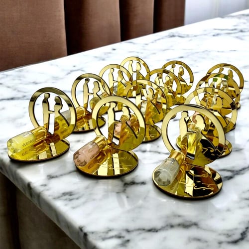 توزيعات زواج ذهبية – عروس وعريس مع مسك فاخر (عدد 1...