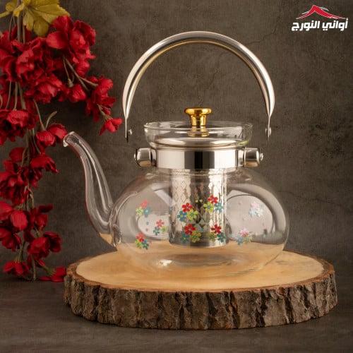 ابريق زجاجي شفاف برسم زهور