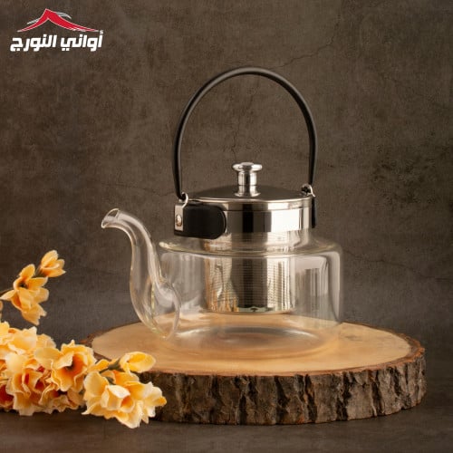 أبريق زجاجي شفاف بمسكة سوداء