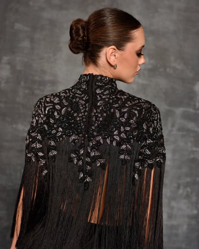Chic black top adorned by silver and pearl embroid...