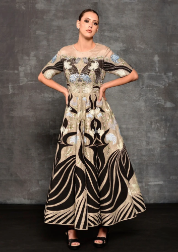 Featured here is a high-neck fit, A-line floor len...
