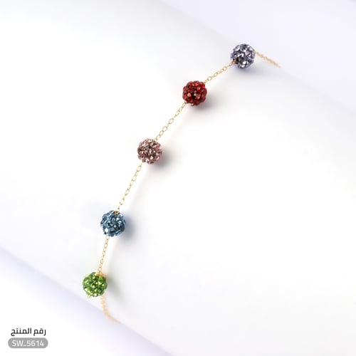 أسوارة ذهب عيار 18 بألوان كريستالية وأناقة ناعمة (...