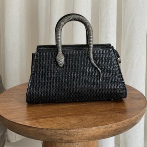 Evening bag with a snake-shaped handle