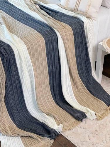 Light summer knitted blanket with striped design a...