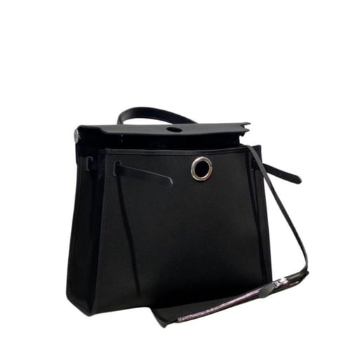 حقيبة هيرباج توال 31 بقماش وجلد أسود من ايرميز