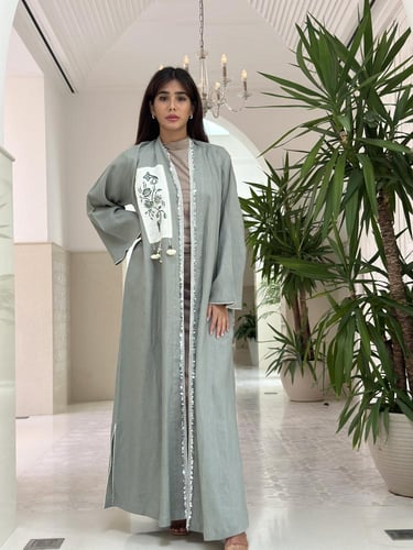 Unique linen abaya with handmade embroidery.