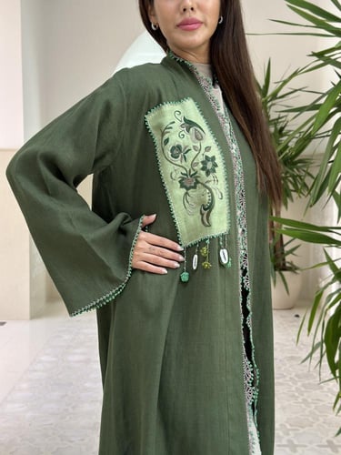 Unique linen abaya with handmade embroidery.