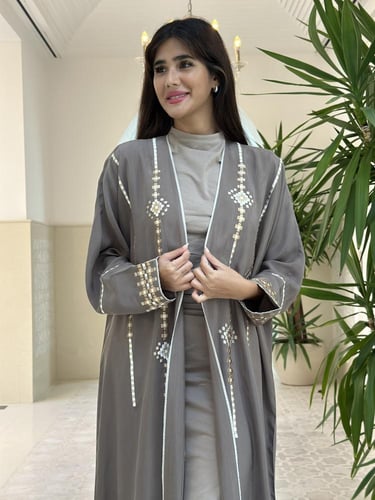 Washed silk abaya with embroidery.