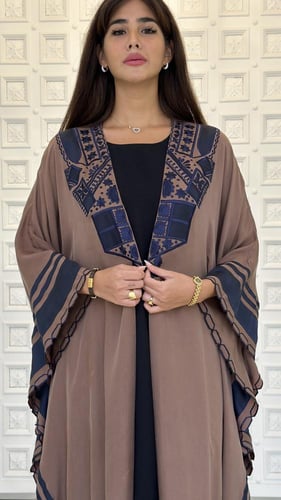 Embroidered silk abaya.