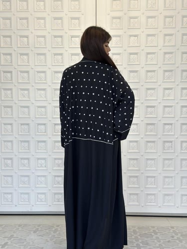 Embroidered silk abaya.