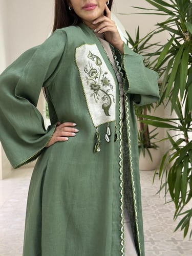 Unique linen abaya with handmade embroidery.