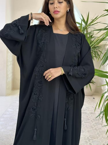 Luxurious abaya with handmade embroidery.