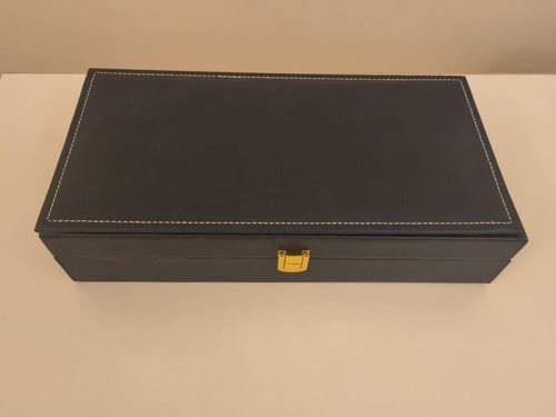 شنطة جلد مستطيلة (٢ ربع تولة + أوقية)