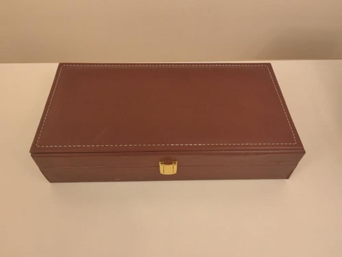 شنطة جلد مستطيلة (٢ ربع تولة + أوقية)