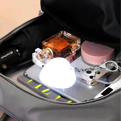 مصباح حقيبة LED على شكل قلب بمستشعر ضوء لتسهيل الع...