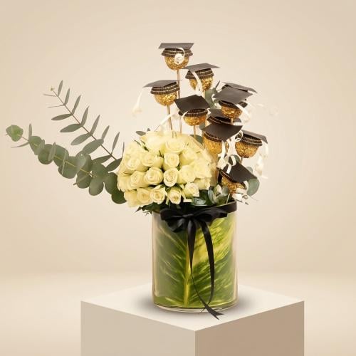 Elegant graduation arrangement with a white rose v...