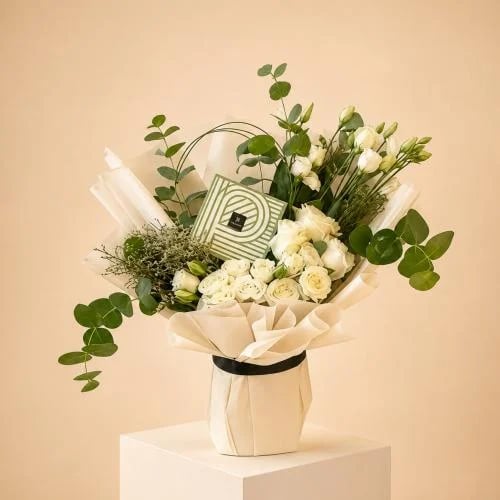 A bouquet of roses with Patchi chocolates