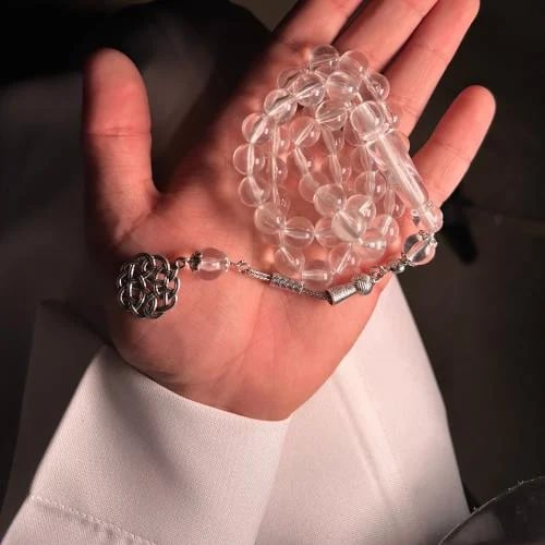 A prayer bead with a clear white color