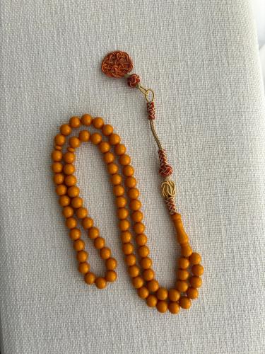 سبحة تراب كهرمان مشغولة يدوياً