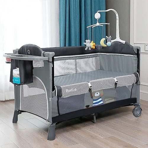 سرير وساحة لعب