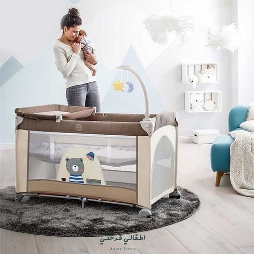 سرير وساحة لعب