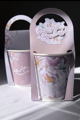 A coffee envelope with a cup and holder from the Eid Joy collection