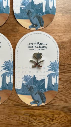 Metal badge (Seven and silver palm)